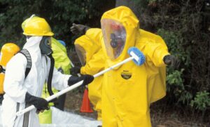 A person in yellow and white suit holding a stick