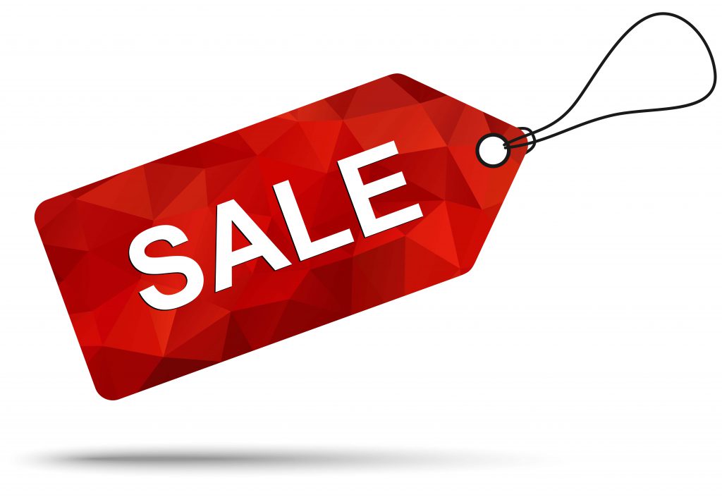 A red sale tag with the word " sale " written on it.