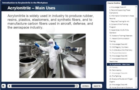 A person in a white suit is working in an industrial kitchen.